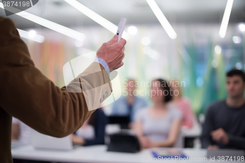 Image of close up of teacher hand while teaching in classroom