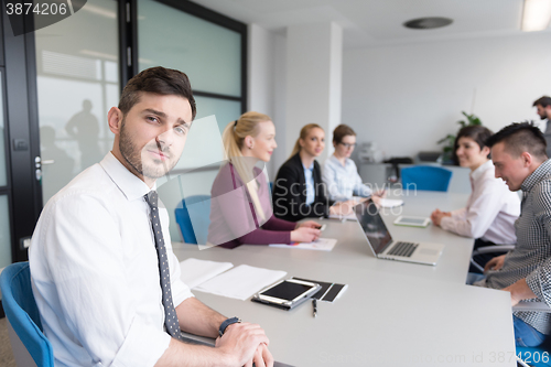 Image of young business people group on team meeting at modern office