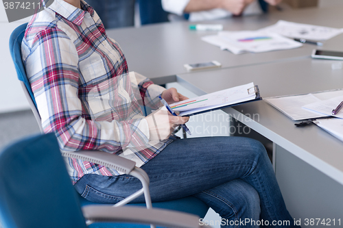 Image of portrait of young business woman at office with team on meeting 