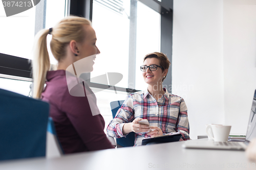 Image of young business woman at modern office meeting room