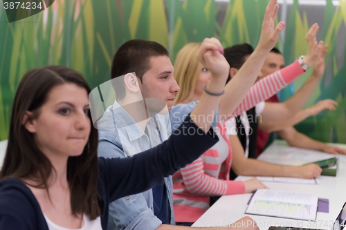 Image of students group raise hands up