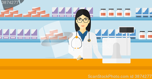 Image of Pharmacist at counter with computer monitor.