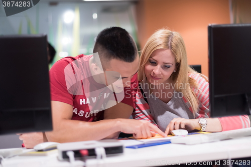 Image of technology students group working  in computer lab school  class