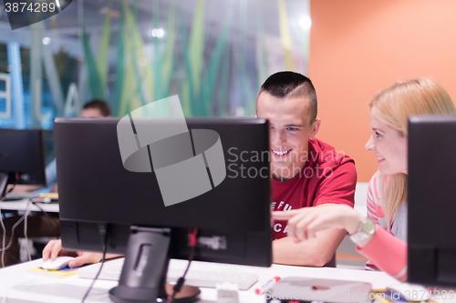 Image of technology students group in computer lab school  classroom