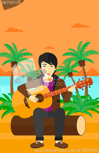 Image of Man playing guitar.