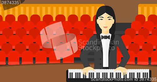 Image of Woman playing piano.