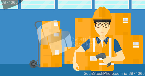 Image of Worker checking barcode on box.