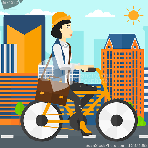 Image of Woman cycling to work.