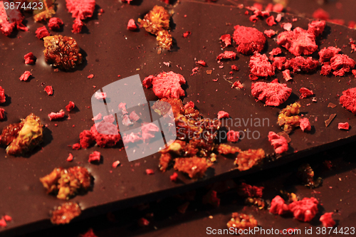 Image of chocolate with nuts and raspberries