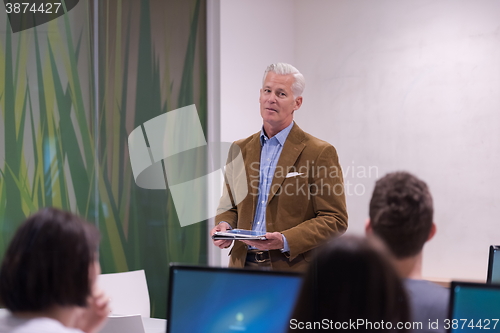 Image of teacher and students in computer lab classroom