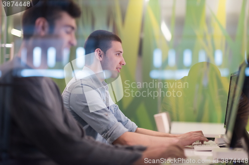 Image of technology students group working  in computer lab school  class