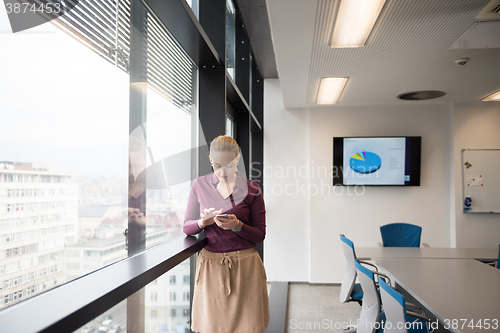 Image of young business woman using smart phone