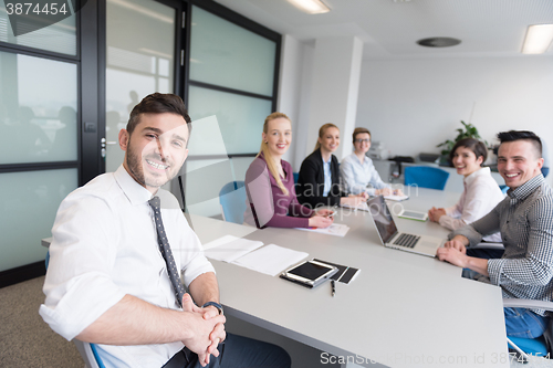 Image of young business people group on team meeting at modern office