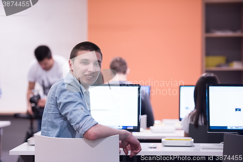 Image of technology students group in computer lab school  classroom