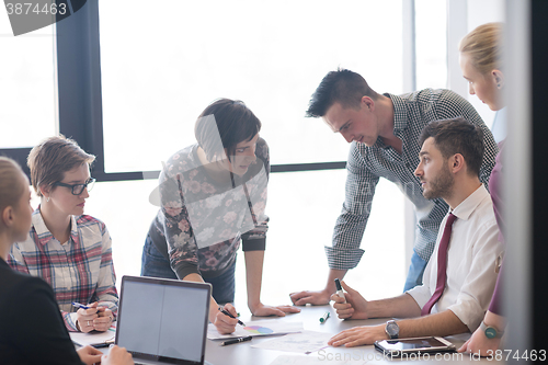 Image of young business people group on meeting at modern office