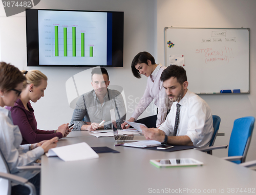 Image of young business people group on team meeting at modern office