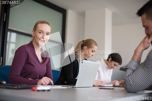 Image of young business people group on team meeting at modern office