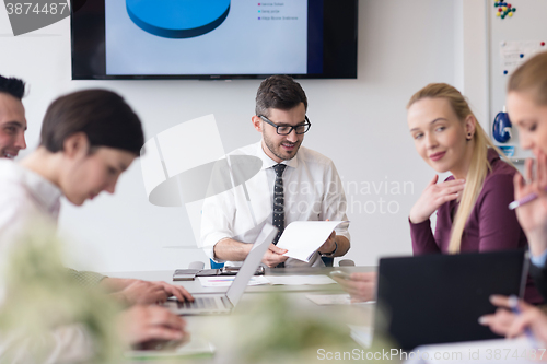 Image of young business people group on team meeting at modern office