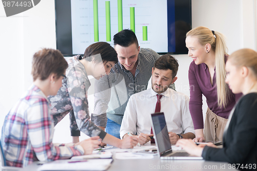 Image of young business people group on meeting at modern office