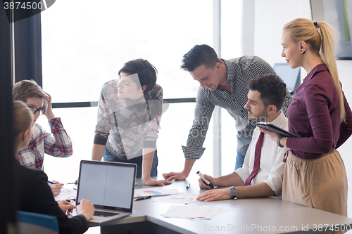 Image of young business people group on meeting at modern office