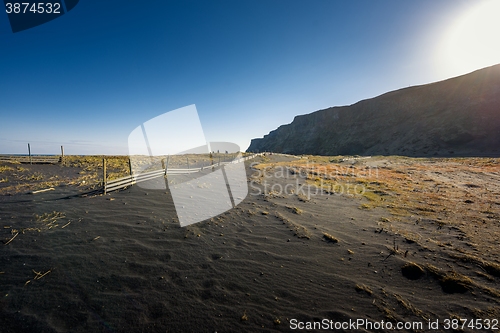 Image of Deserted shore with black sand