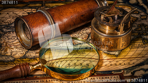 Image of Old vintage compass on ancient map