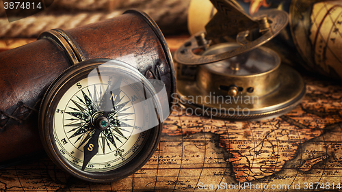 Image of Old vintage compass on ancient map