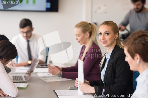 Image of young business people group on team meeting at modern office