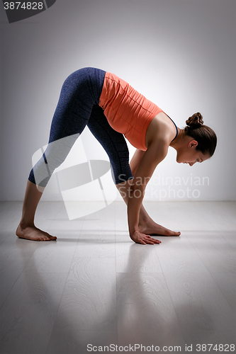 Image of Woman stretching in Ashtanga Vinyasa yoga asana