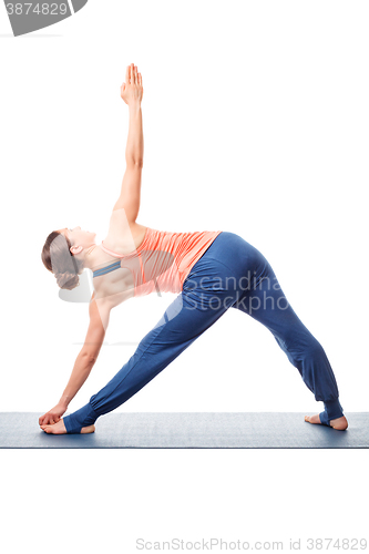 Image of Young fit woman doing Ashtanga Vinyasa Yoga asana