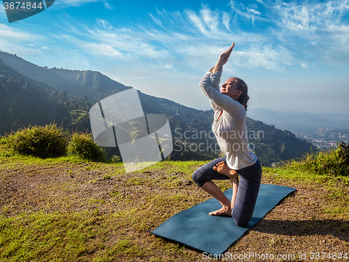 Image of Woman doing Ashtanga Vinyasa yoga advanced asana 