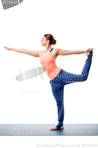 Image of Woman doing yoga asana Natarajasana