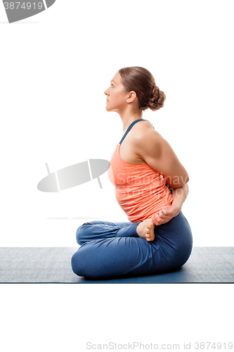 Image of Sporty woman doing  Ashtanga Vinyasa yoga asana