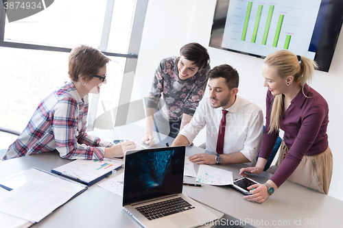 Image of young business people group on meeting at modern office