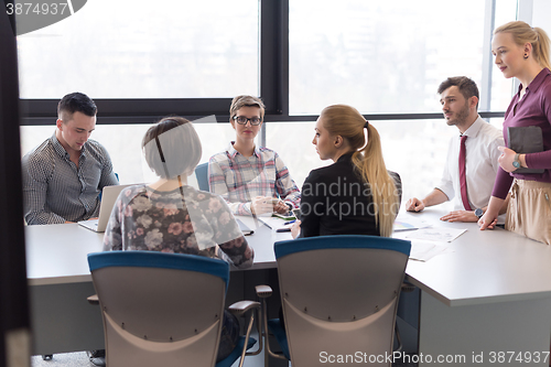 Image of young business people group on meeting at modern office