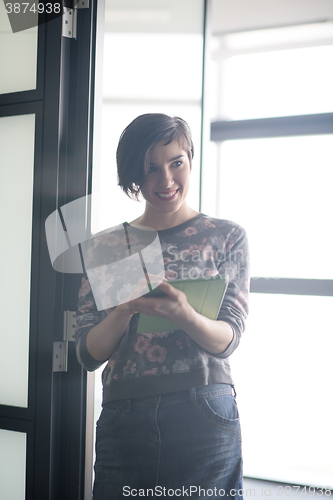 Image of business woman working on tablet