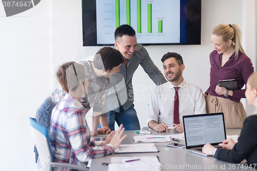 Image of young business people group on meeting at modern office