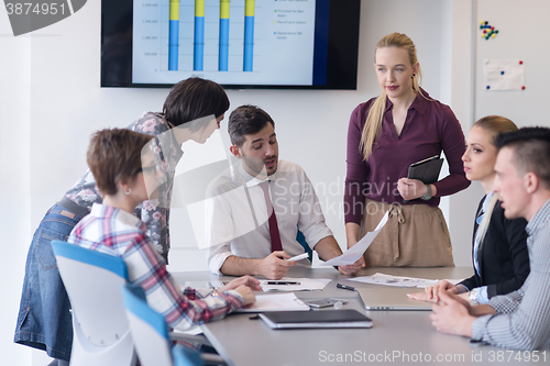 Image of young business people group on meeting at modern office