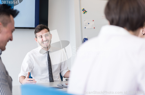 Image of young business people group on team meeting at modern office