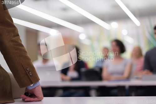 Image of close up of teacher hand while teaching in classroom