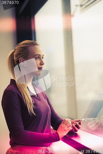 Image of business woman using smart phone at office