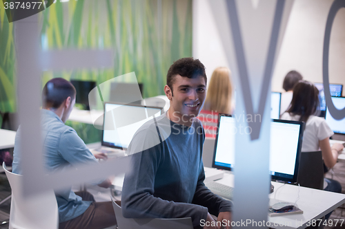 Image of technology students group working  in computer lab school  class