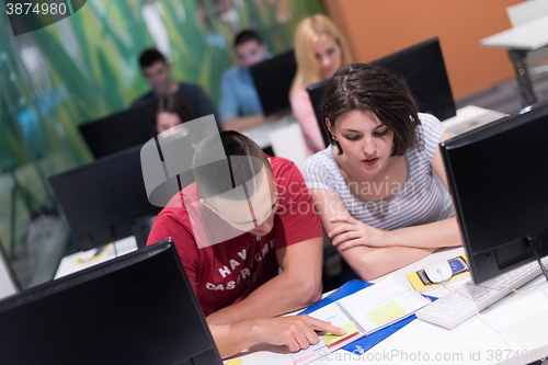 Image of technology students group working  in computer lab school  class