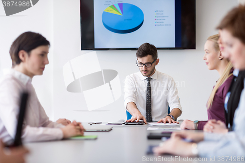 Image of young business people group on team meeting at modern office