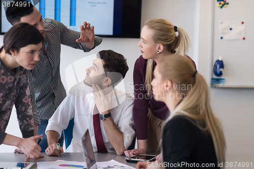 Image of young business people group on meeting at modern office