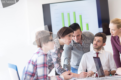 Image of young business people group on meeting at modern office