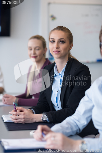 Image of young business people group on team meeting at modern office