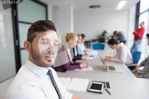 Image of young business people group on team meeting at modern office