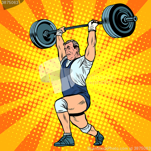 Image of Weightlifting a weightlifter raises the bar