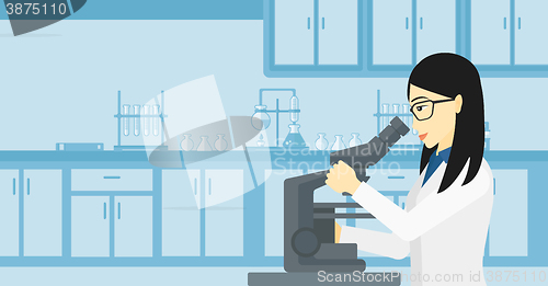 Image of Laboratory assistant with microscope.